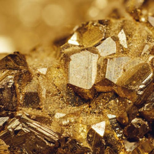 A detailed close-up shot of the mineral iron pyrite that is also known as the fool's gold.